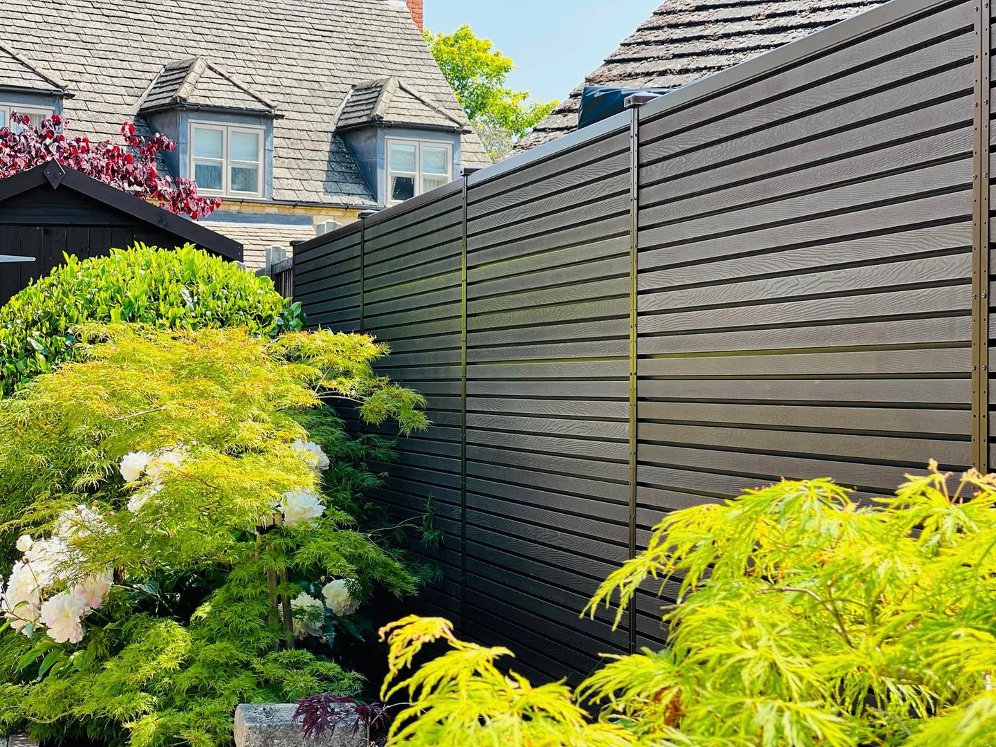 Composite slatted fencing using DuraPost urban in anthracite grey